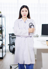 Portrait confident asian professional female doctor wearing white coat stethoscope stand with coffee in modern clinic office hospital modern expert healthcare medical technology services consultation.