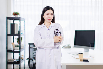 Portrait confident asian professional female doctor wearing white coat stethoscope stand with coffee in modern clinic office hospital modern expert healthcare medical technology services consultation.