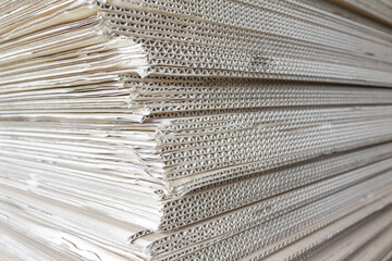 Image of stacked cardboard boxes taken from the side