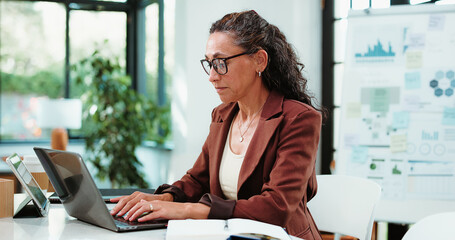 Laptop, typing and business woman in office for financial review, statistics or budget report....