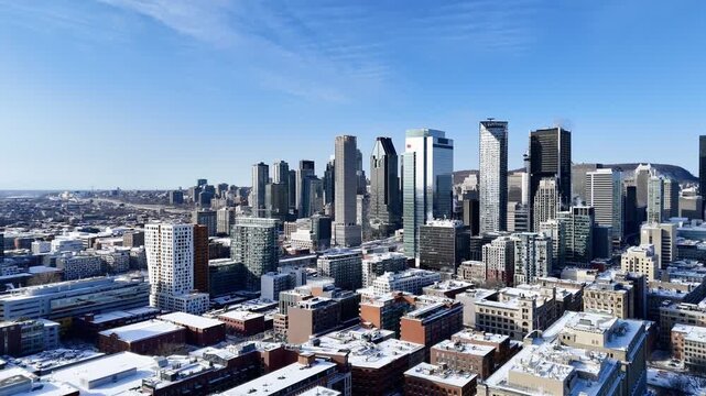 Downtown Montreal skyline with modern skyscrapers and winter cityscape under clear blue sky, Quebec, Canada. g.