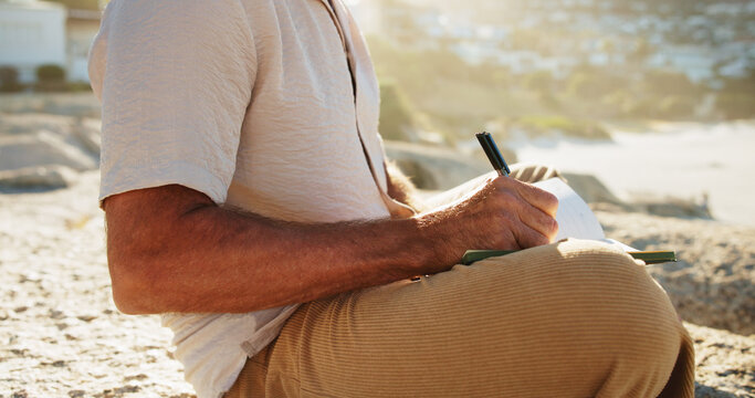 Hands, man outdoor and writing with diary, personal development plan and goal setting for inspiration. Daily reflection, notes and person with journal, mindfulness and insight for self improvement.
