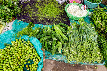 Selling fresh vegetables in a traditional market
