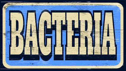 Aged retro bacteria sign on wood