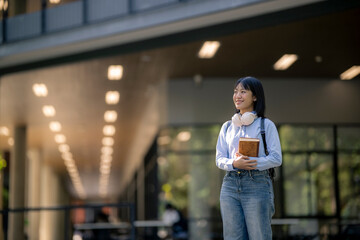 Asian female student smiling on campus learning