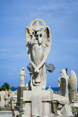 Fototapeta premium Stunning marble angel statue on a historic family tomb in the Santa Maria Magdalena de Pazzis Cemetery in Old San Juan, Puerto Rico
