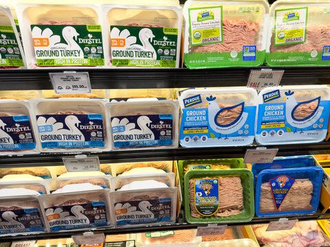 Packaged Ground Turkey And Chicken Meat Display In Grocery Store Cooler