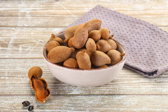 Tropical exotic Tamarind fruit heap