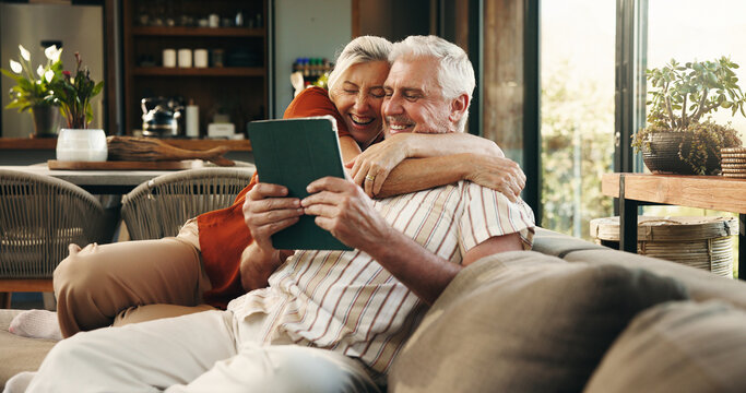 Hug, tablet and senior couple on sofa excited for good news, winning and website in home. Retirement, marriage and old man and woman on digital tech for online giveaway, bonding and relax together