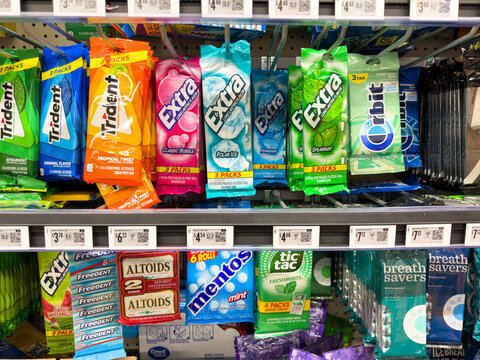 Assorted Gum And Mints Display On Grocery Store Shelf