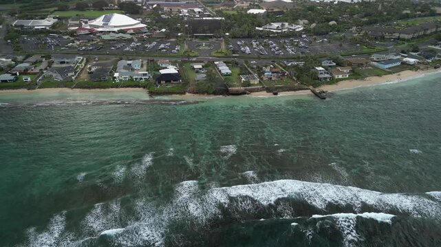 Sideways Drone Flight Over Coral Reef and Beachfront Homes in Laie Hawaii | Lateral Aerial View of Oahu Coastline
