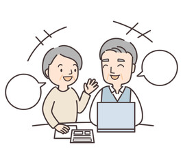 書類とPCを前に楽しそうに話すシニア夫婦