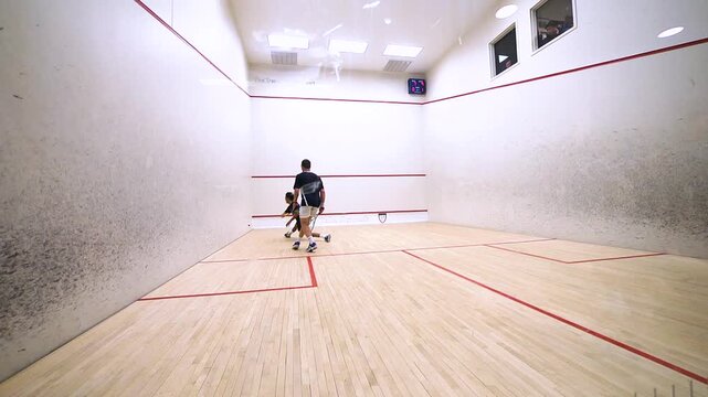 two men playing squash