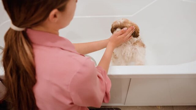 White Woman Washing Puppy Face In Bathtub, Gentle Fingers Around Muzzle, Fluffy Fur Damp, Intimate Closeup, Soft Domestic Light, Nurturing Grooming Scene, Quiet Bonding During Hygiene Routine