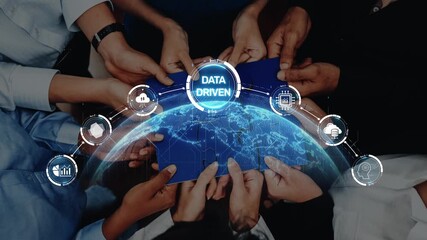 A collaborative scene showcasing diverse hands holding digital devices above a globe, representing teamwork in data-driven strategies with technology icons. Raster - Powered by Adobe