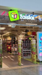 Obraz premium Vilnius Lithuania - 03.29.2025 Colorful toy store entrance with bright signage, decorated interior, and shelves full of plush toys, LEGO sets, and games, inviting kids and families to explore and shop