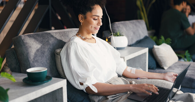 Woman, relax and laptop in clinic, iv drip and happy for recovery with fluid, writer and remote work. Healthcare, nutrition and person with tech for freelance article, typing and immune system boost