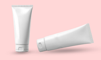 Two blank white cosmetic tubes, one upright and one tilted, against a soft pink background