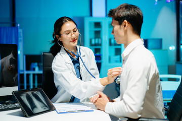Professional doctor examining patient with stethoscope in modern clinic, healthcare consultation, medical checkup, diagnosis, trust, technology and wellness care.