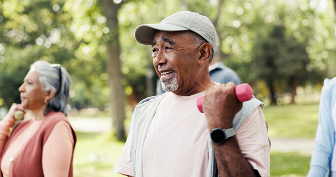 Man, dumbbells and old people in park with workout, class and nature for senior fitness club. Retirement, hobby and weights with elderly group, outdoor or exercise together for health and wellness