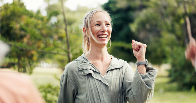 Fitness, class and instructor in park with smile, training session and guide in group performance. Happiness, coach or woman in nature with program, motivation and teaching in wellness club.