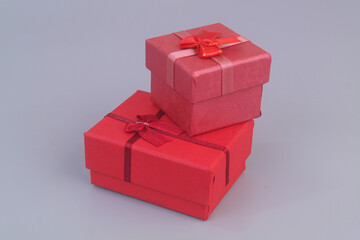 Two gift boxes on grey background. Birthday and resent concept. Copy space for text.