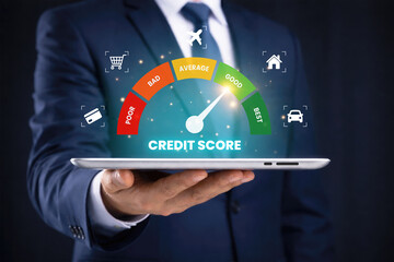 Businessman holding digital tablet with credit score gauge dashboard showing financial rating risk assessment personal finance credit analysis banking technology and investment concept