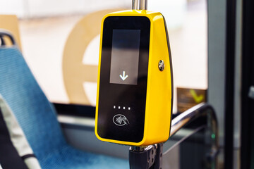 Contactless payment device installed on bus inside city transport system