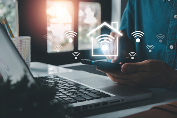 A person using a smartphone to control smart home devices, symbolizing wireless connectivity and modern technology.