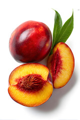 Fresh ripe nectarines whole and halved with pit isolated on white background for healthy eating and summer recipes.