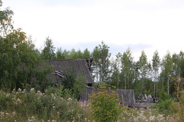 Abandoned, uninhabited houses in old villages from the time of collective farms and collectivization in the Soviet Union. 1930-1940-1950s, Sloboda village, north of the Kirov region, Russia.