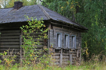 Abandoned, uninhabited houses in old villages from the time of collective farms and collectivization in the Soviet Union. 1930-1940-1950s, Sloboda village, north of the Kirov region, Russia.