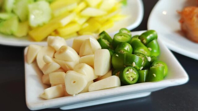 Fresh chilies and chopped garlic in a bowl.