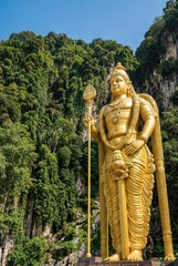 Gold statue of lord murugan.
