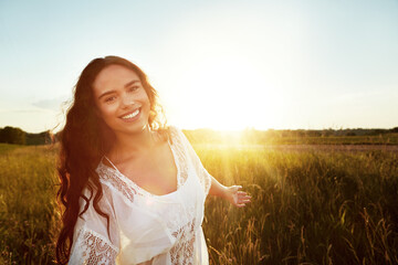 Portrait, boho and woman in countryside, carefree and stylish with cotton dress at sunrise or nature. Outdoor, happiness and person with bohemian fashion, sunshine and space on vacation in Mexico