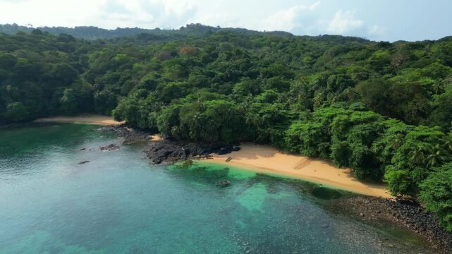 Aerial view towards Margarida beach over the amazing turquoise sea. Ilha do Principe,Sao Tome,Africa