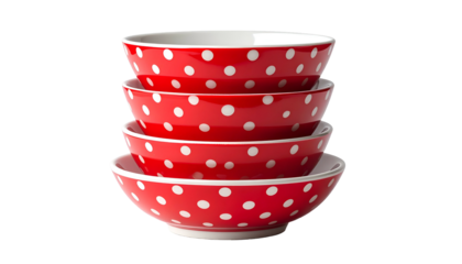 Stack of four red ceramic bowls with white polka dots, on a transparent background