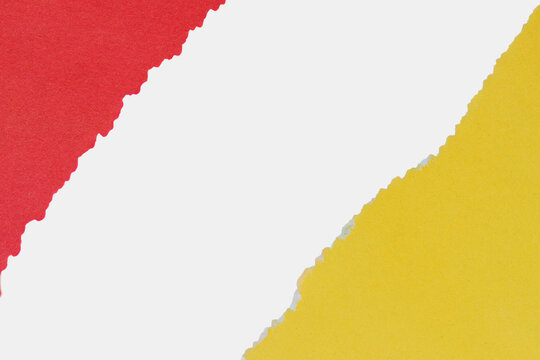 Diagonal torn paper collage in red and yellow with white gap in center. Contrast, creativity, dynamic background design flow. Copy space