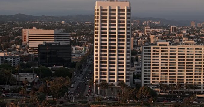 Santa Monica California Aerial v22 zoomed flyover State Beach capturing buildings on coastal bluff, Pacific coast highway, and downtown cityscape at sunset - Shot with Mavic 3 Pro Cine - May 25th 2024