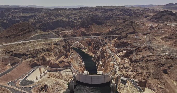 Hoover Dam Nevada Aerial v18 birds eye view flyover rugged desert terrain capturing concrete dam and bypass bridge spanning the Black Canyon of the river - Shot with Mavic 3 Pro Cine - Apr 16th 2024