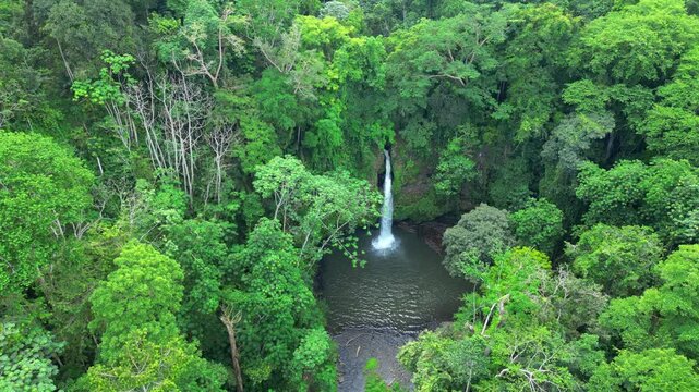 Aerial view descending through the forest towards the Guegue waterfall in S&atilde;o Tom&eacute; e Principe,Africa