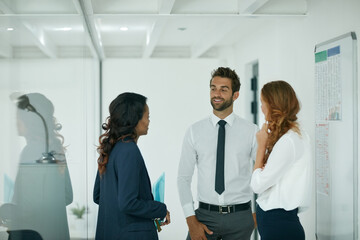 Obraz premium Discussing their opportunities for success. Cropped shot of colleagues having a discussion in an office.