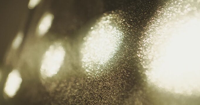 Glare of light Glare of light on a black fluted surface, close-up