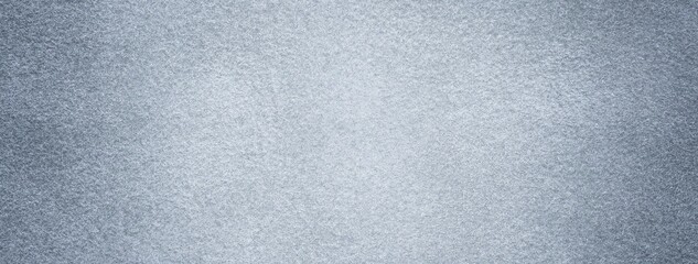 Light gray suede fabric background with matte velvet texture, soft felt textile surface with...