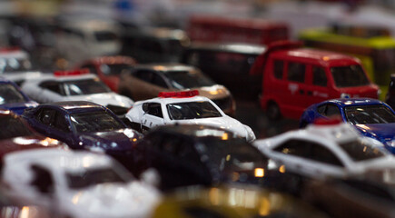 Miniature Toy Cars Collection with Police Car in Crowded Display