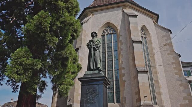 Ulrich Zwingli Statue in Front of Grossm&uuml;nster Church, Zurich. Filmed on 19 july 2025.