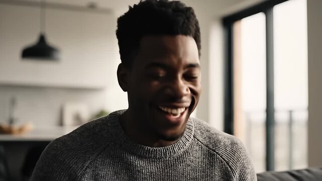 Young african american man reacting with initial surprise and then happy expression, showing emotional progression footage