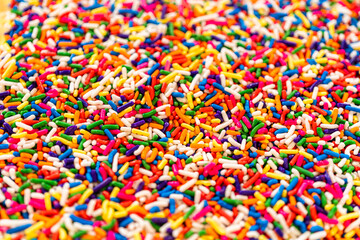 Macro Shot of Rainbow Sprinkles Background