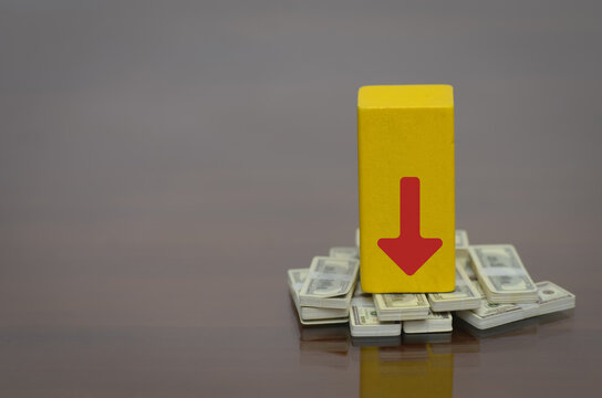 Financial loss and reduced purchasing power represented by downward arrow on money stacks.