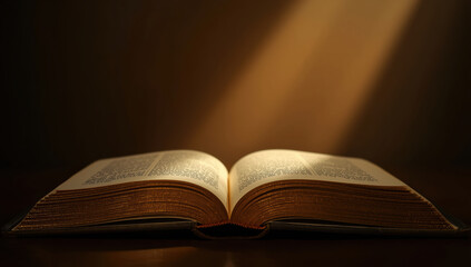 Open book on wooden table with warm light beam and calm atmosphere